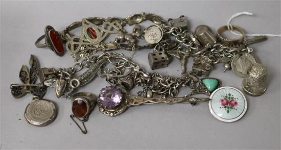 A small group of silver and marcasite jewellery including two charm bracelets and a Norwegian enamel brooch.